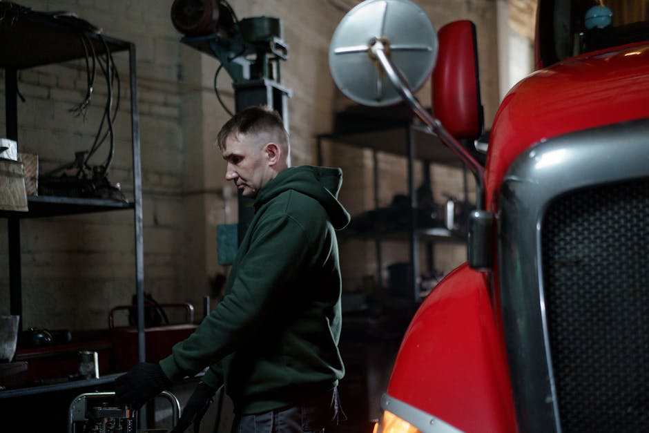 Professional tow truck driver in work uniform providing emergency towing service