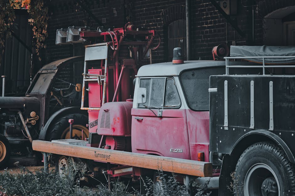 Professional flatbed towing truck performing vehicle transportation service